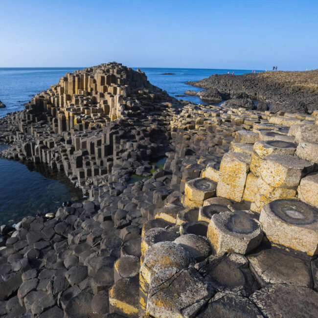 hexagon shaped rock formation at the sea